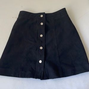 This is a black tight mini skirt from H&M, 5 Metal buttons, 100% polyester